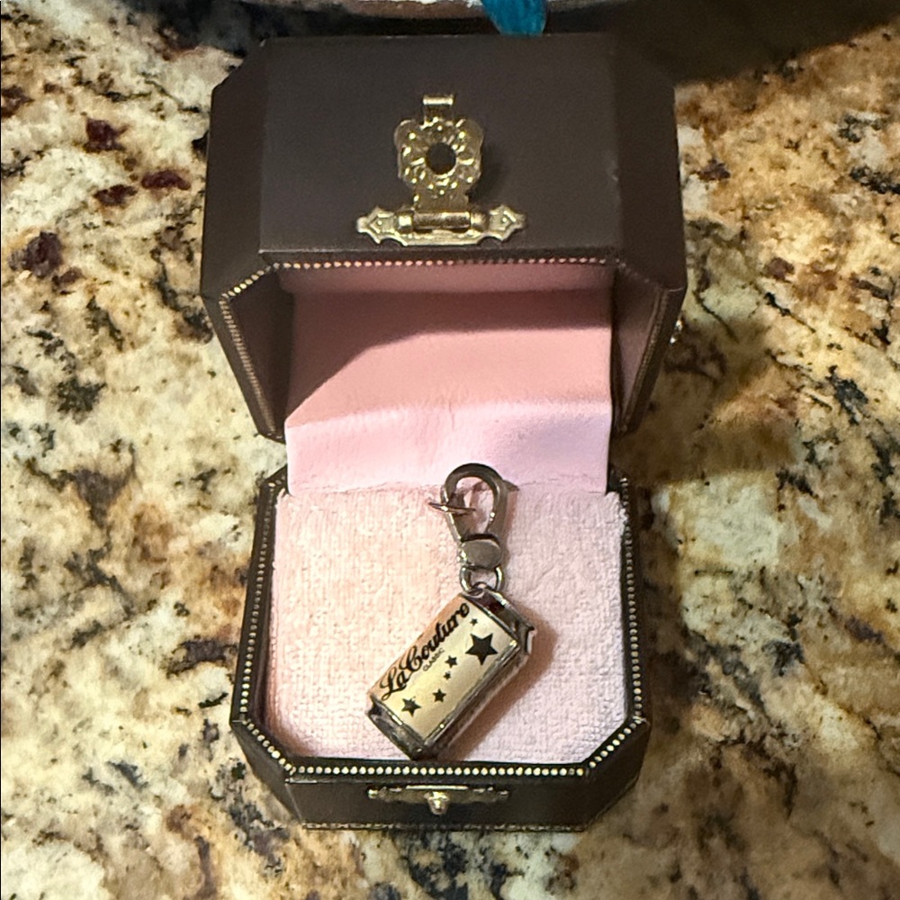 New in box Juicy Couture soda can charm